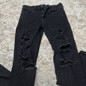 Ripped Black American Eagle skinny jeans